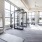 a large room with a large glass door and a large mirror