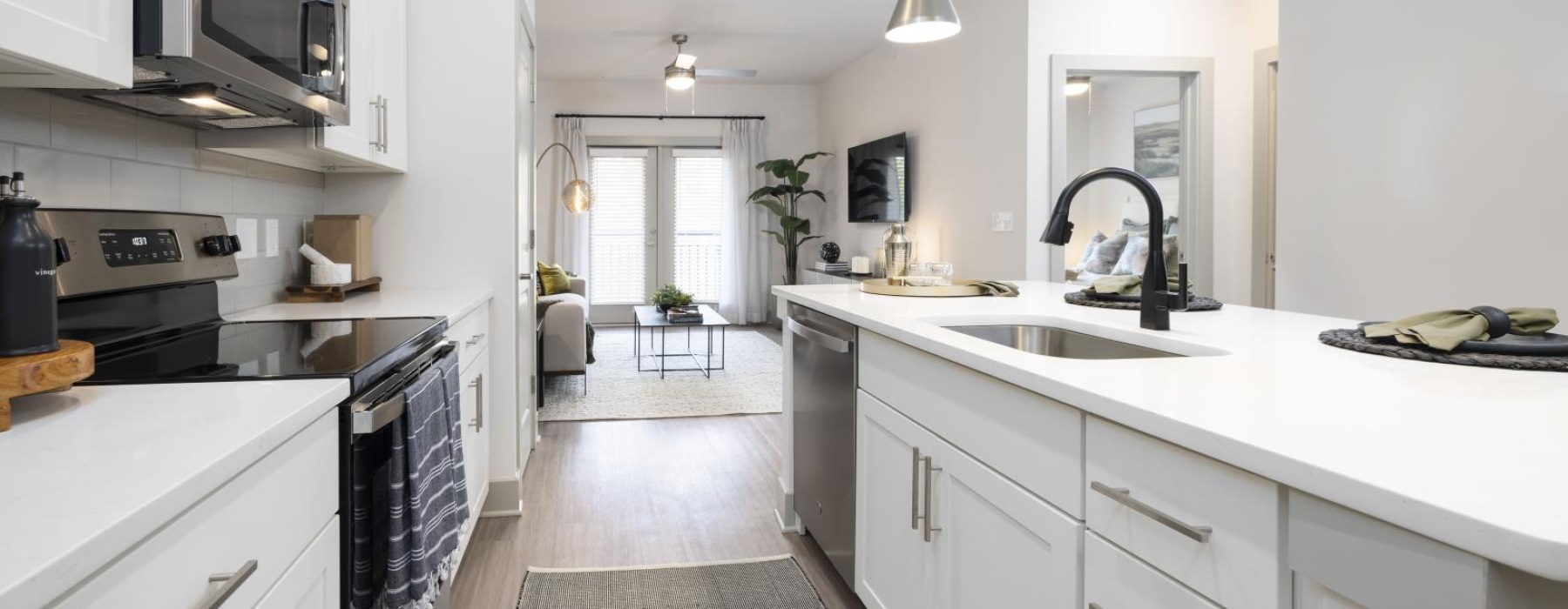 a kitchen with white cabinets